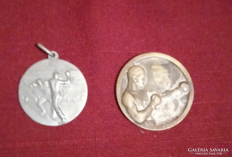 2 Silver medals highlighting Wrestling in the 30s and 40s