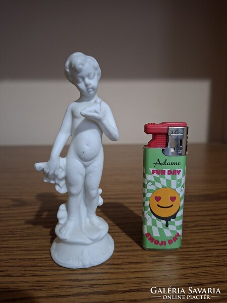 Capodimonte biscuit, (bisquit) porcelain child holding a bird. 11.9 Cm. Flawless.