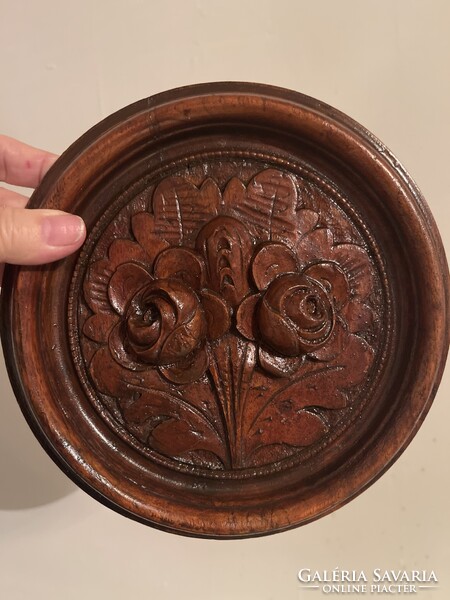 Antique carved wooden wall picture with roses.