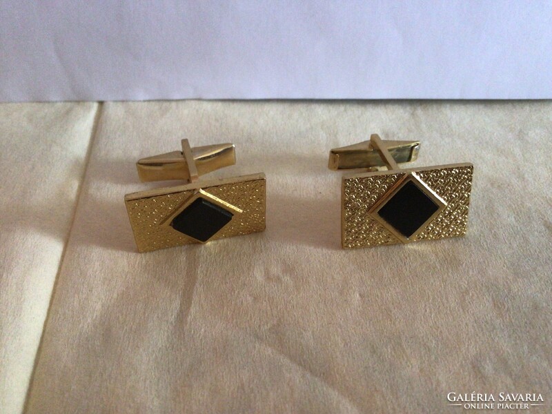Elegant vintage cufflink with gold base and black inlay