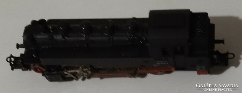 Toy locomotive with wagons and tracks