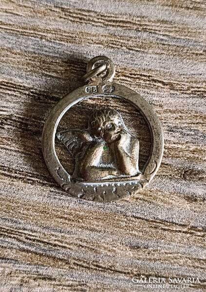 Antique silver putto pendant